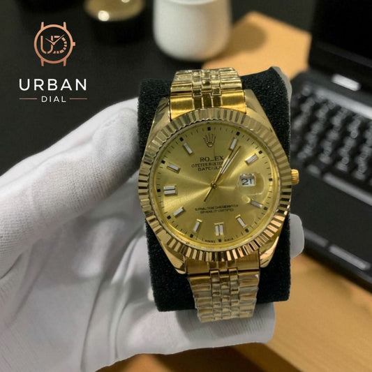 A gold-tone Rolex Oyster Perpetual Datejust with a fluted bezel and jubilee-style bracelet