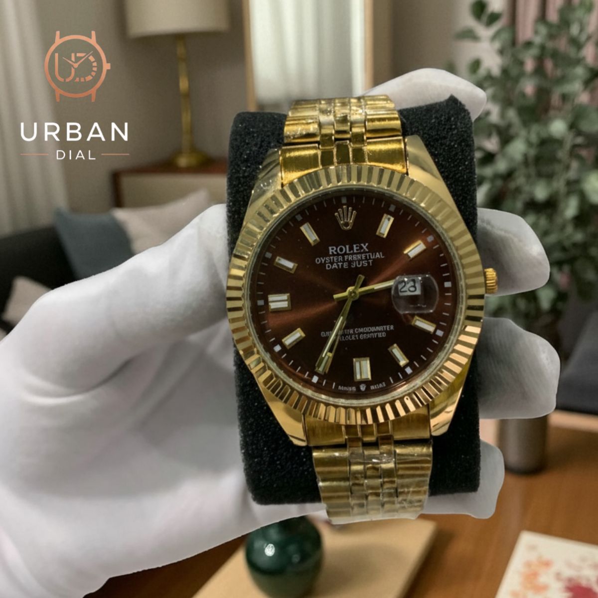 A gold-tone Rolex Oyster Perpetual Datejust with a fluted bezel and jubilee-style bracelet